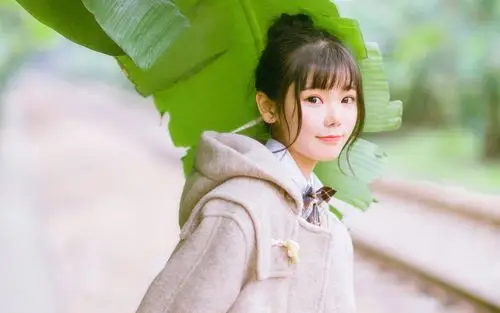 俏皮可爱丸子头美少女户外写真图片桌面壁纸