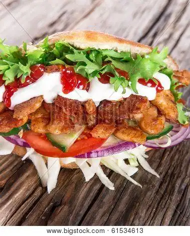 doner kebab - grilled meat, bread and vegetables