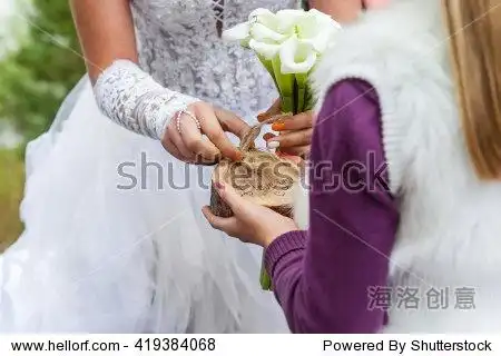the bride takes the engagement ring on the wedding ceremony