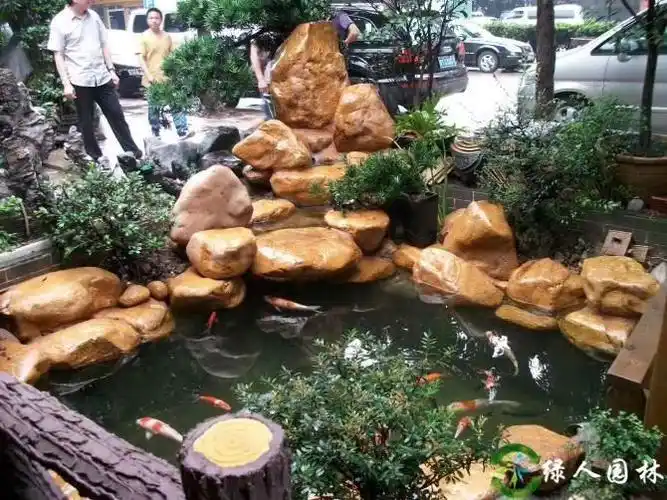 广东黄蜡石假山鱼池驳岸鱼池鹅卵石