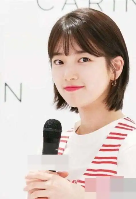 圆脸女生剪什么刘海好看有靓度 向你招手的短卷烫头发被俘虏住