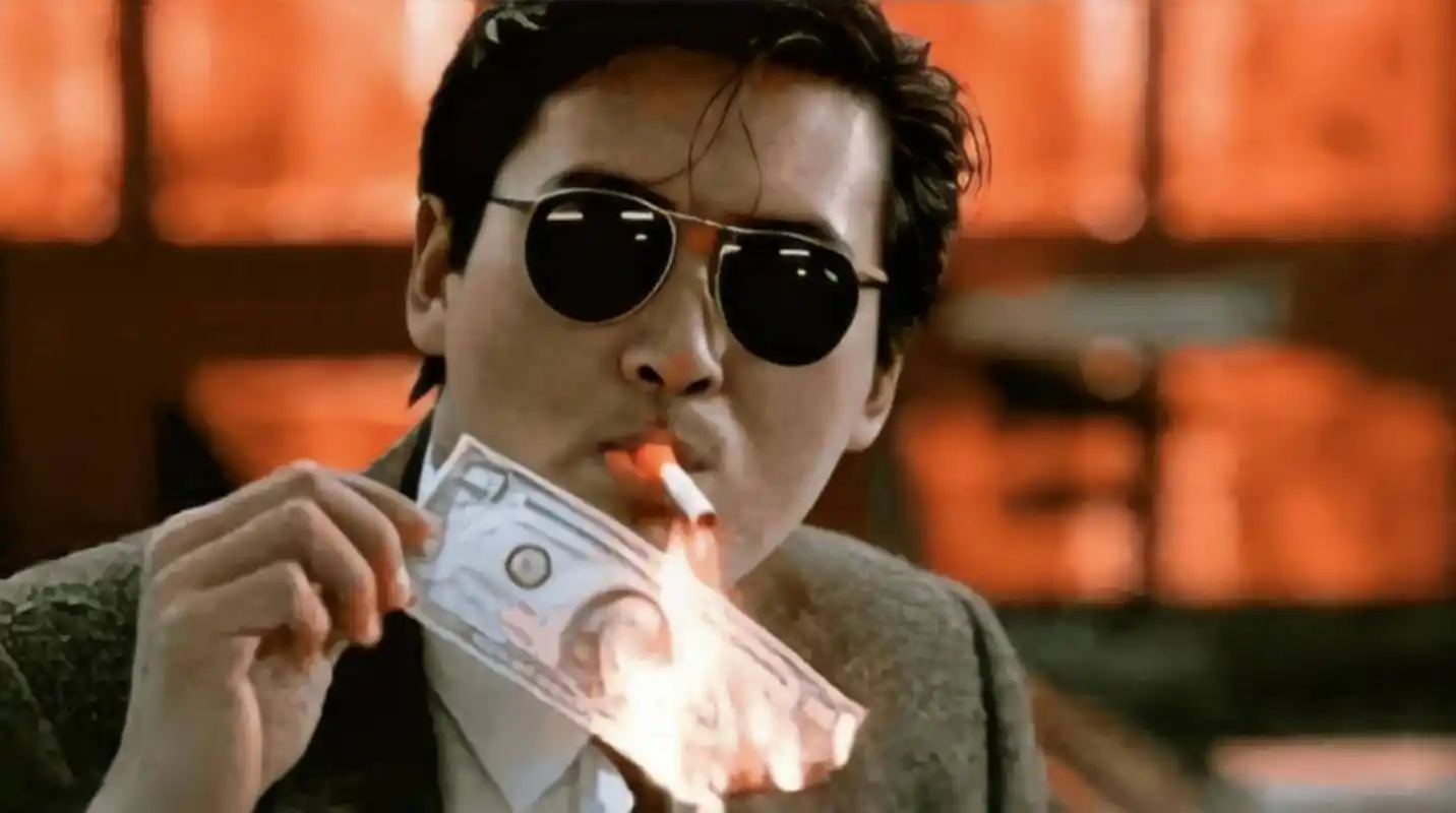 至于周润发,也在《英雄本色》中,自己设计"小马哥"叼火柴的环节.