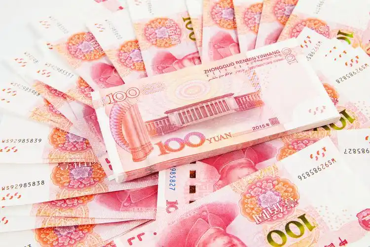 百元人民币堆放背景图片