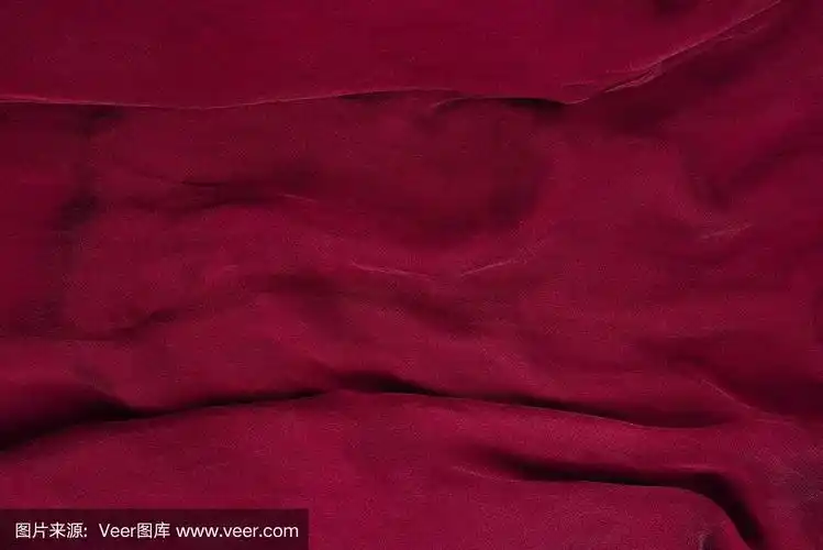 柔软光滑的酒红色丝绸织物背景.面料质地.