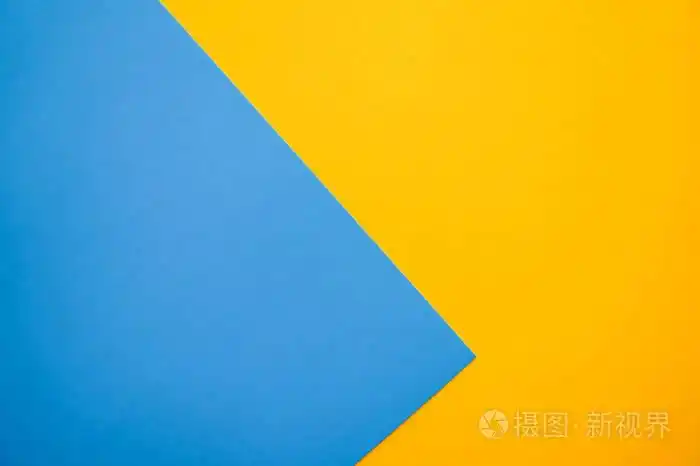 可爱的平躺背景与彩色纸页.黄色和蓝色