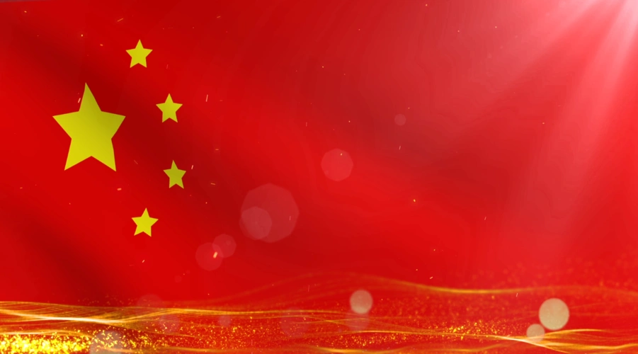 金色粒子光斑在飘扬的国旗上跳动背景视频素材