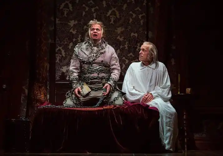 joe foust (jacob marley) and larry yando (ebenezer scrooge) in "