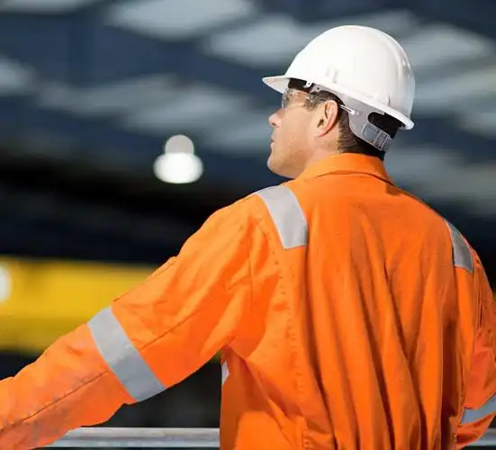 engineer overseeing factory floor, machine control, facility