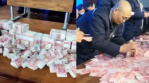 公司用1000万现金办数钱比赛 百元大钞铺满长桌