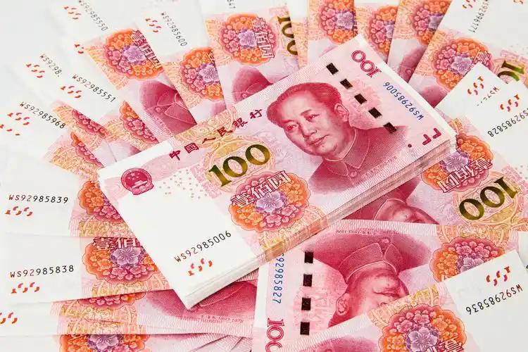 百元人民币堆放背景图片