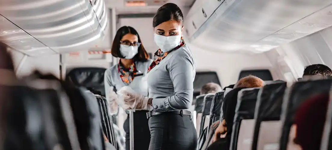 air hostesses working in the aisle