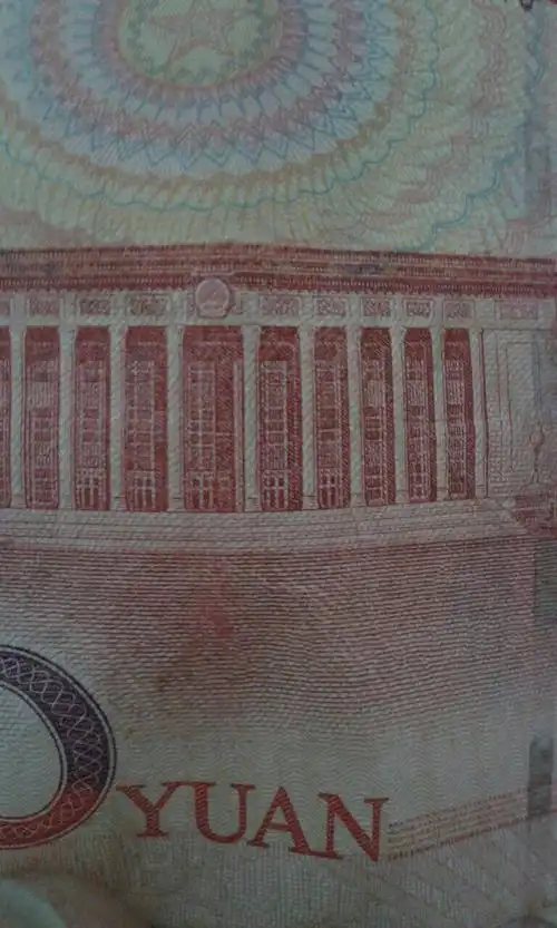 05年100元人民币100元1字长了个角还有毛爷爷头像有明显蓝色种左肩有