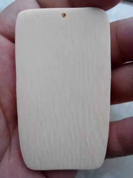 最简单最直观的办法,象牙表面如果有菱形的纹路,那就基本上可以断定