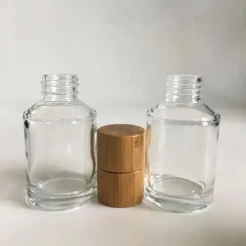 工厂热卖化妆品包装 60毫升透明斜肩玻璃瓶与竹螺丝盖