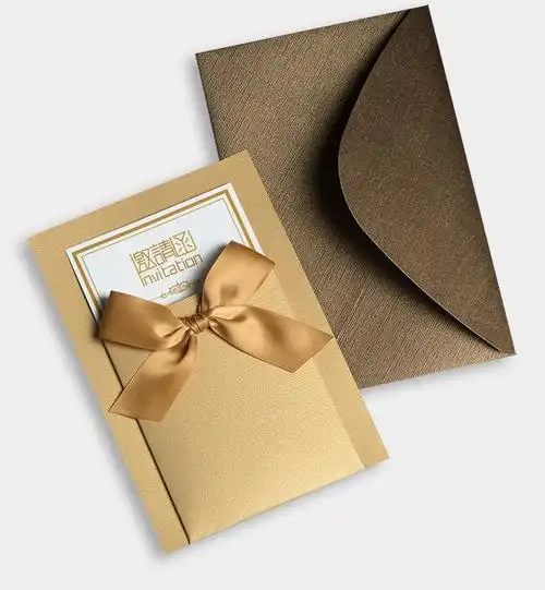 golden color business invitation card with ribbons