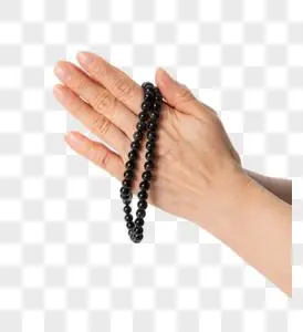 手拿佛珠祈福图片素材