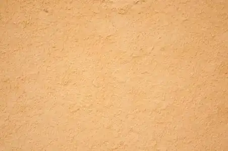 背景或纹理的太阳烤的泥巴墙照片