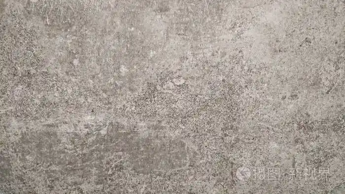 具有天然水泥质地的老灰墙在选择性聚焦中的抽象背景