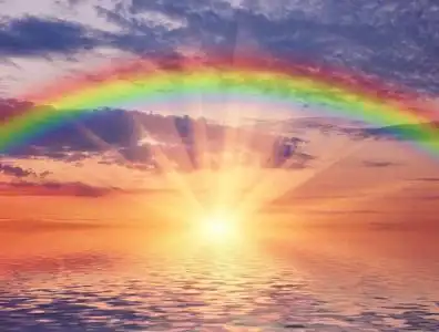 海洋夕阳与彩虹摄影图