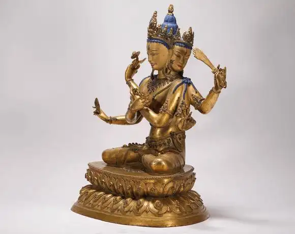 liaodu art auction清代铜鎏金三头六臂佛造像  a bronze gilt three