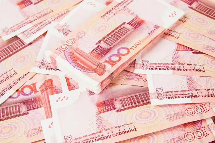 百元人民币堆放背景图片