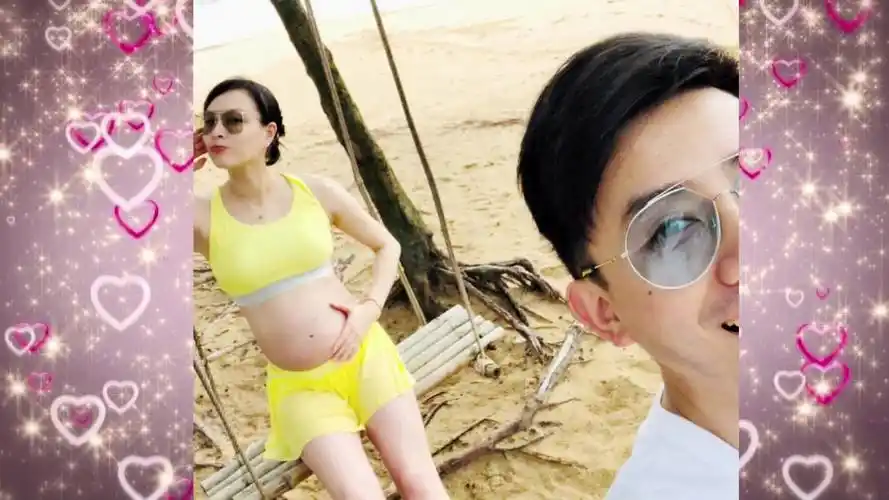 吴敏霞海边度假晒孕肚照:1 1=3的快乐中秋