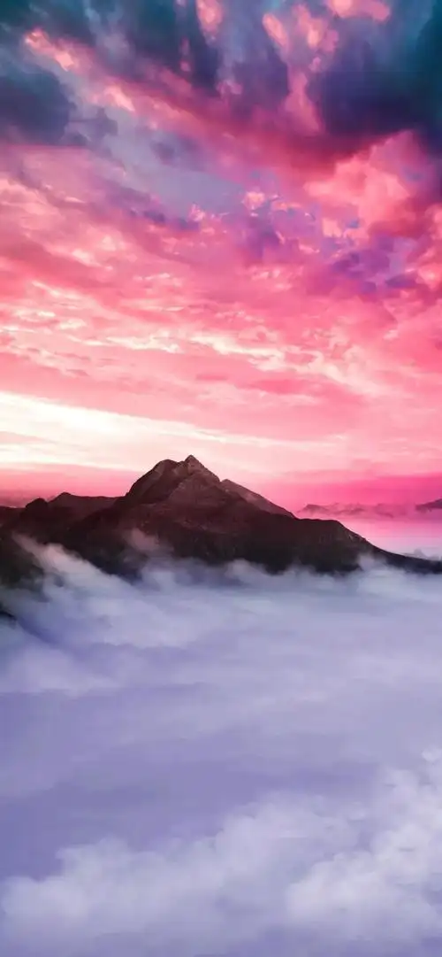 粉色天空和山间云海唯美景色手机壁纸