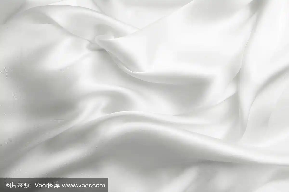 优雅的白色柔软的丝绸与波浪,纹理背景
