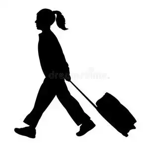 一个学生女孩走路,黑色的剪影照片