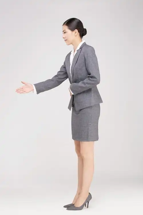 商务女性握手礼仪背景图片