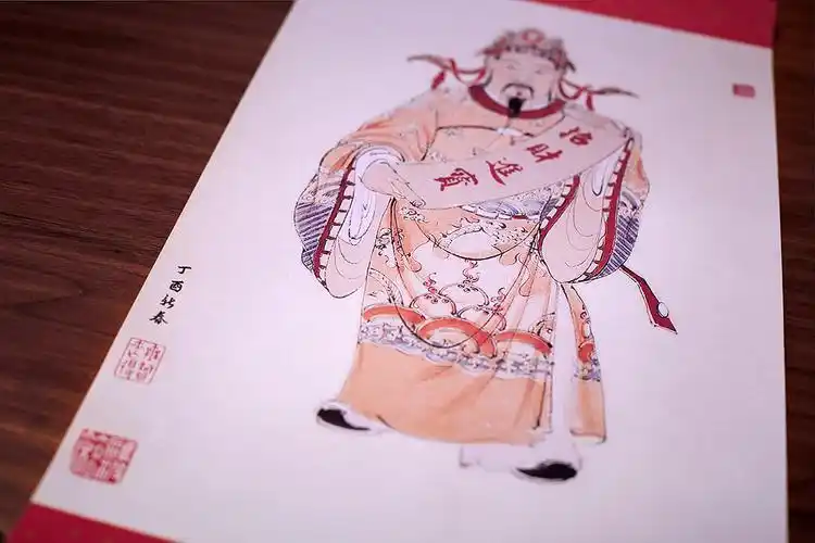 对联手稿出自青年书法家李明桓,财神原画出自古典国画家董天昊.