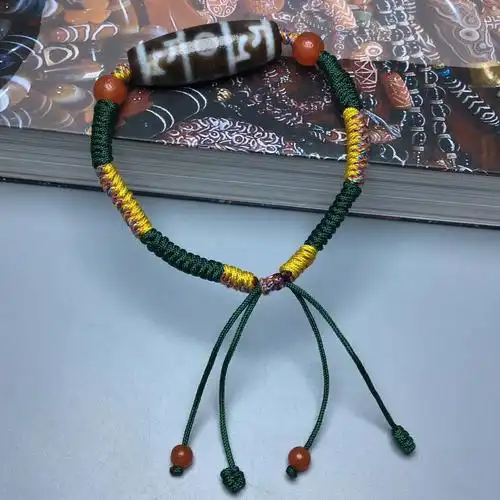藏区回流老料莲师法器三眼天珠精心编制手链