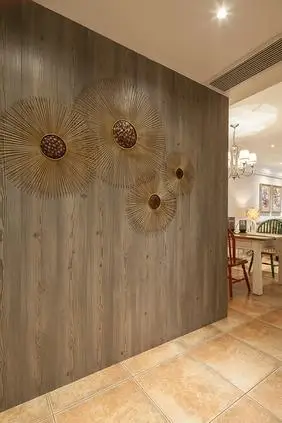 背景墙设计成原木色,木质的肌理赫然在里,无不让我们再次地展现了一把