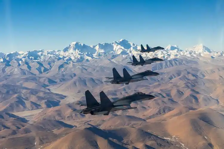 j-11 fighter jets fly over plateau area