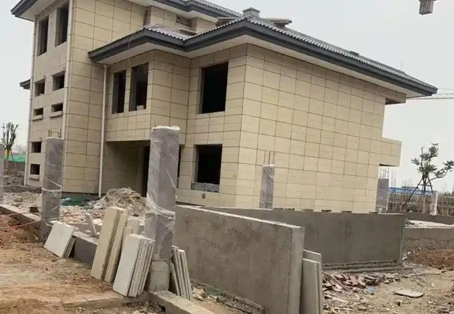 芝麻灰干挂外墙施工价格主要看石材的完成面钢架的系统是用背栓式还是